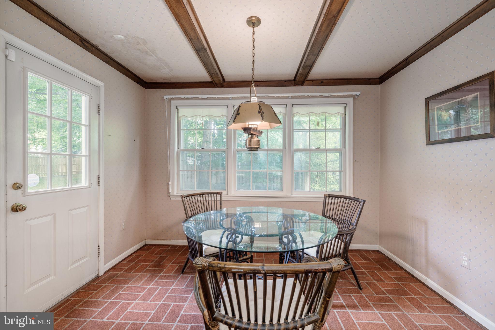 8009 Hackamore Drive Potomac, MD 20854 - Photo 7 of 19 Table space with backyard access