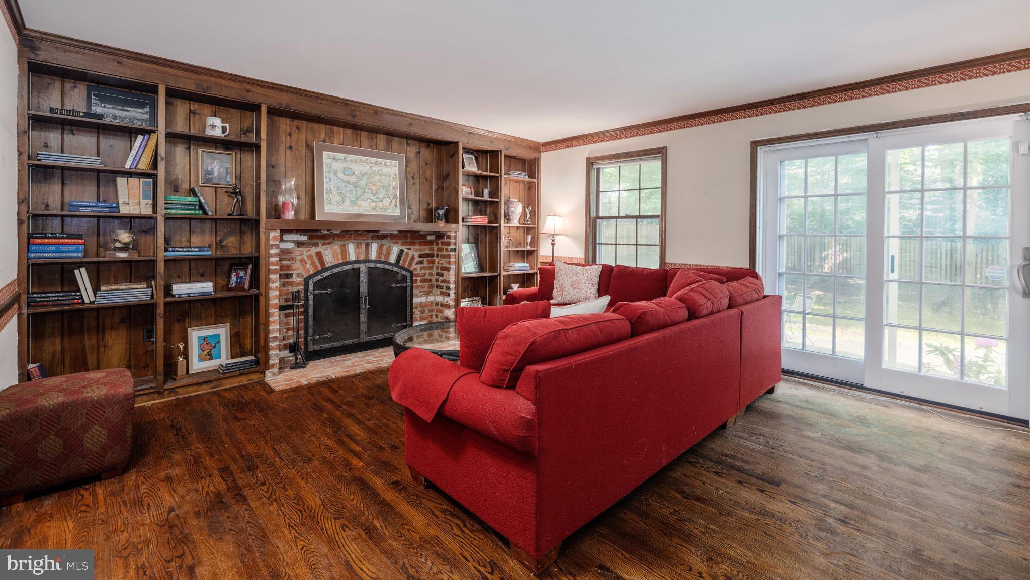 8009 Hackamore Drive Potomac, MD 20854 - Photo 8 of 19 Family room with wood-burning fireplace