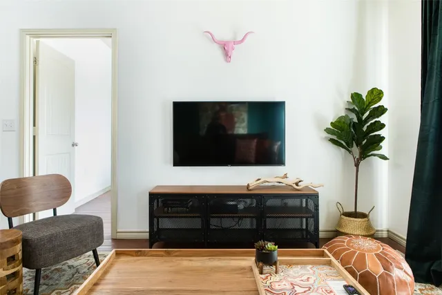 a living room with furniture and a flat screen tv