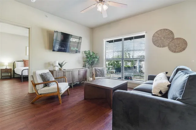 a living room with furniture fireplace and a flat screen tv