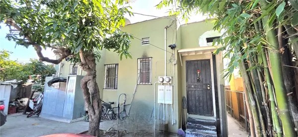 a view of a building with a tree