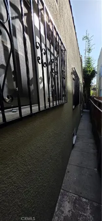 a view of a balcony with wooden fence
