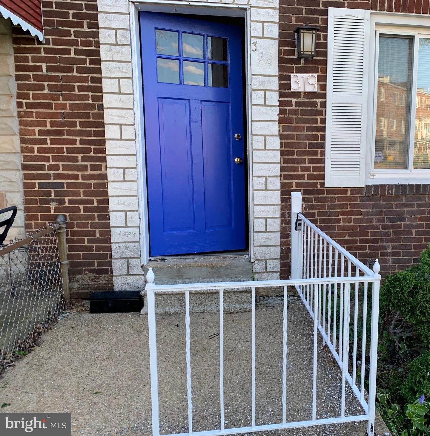 319 Grove Park Road Baltimore, MD 21225 - Photo 3 of 59 Front door, white rails, shutters, porch light