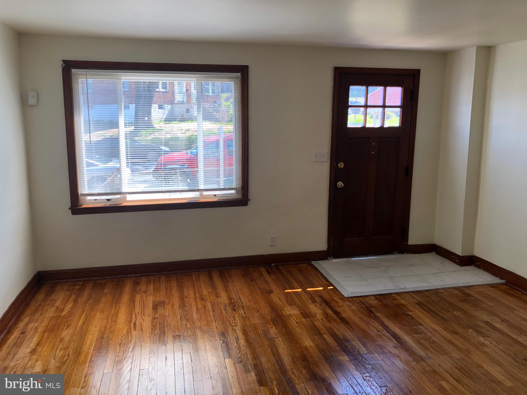 319 Grove Park Road Baltimore, MD 21225 - Photo 26 of 59 Oversized window view and front door light