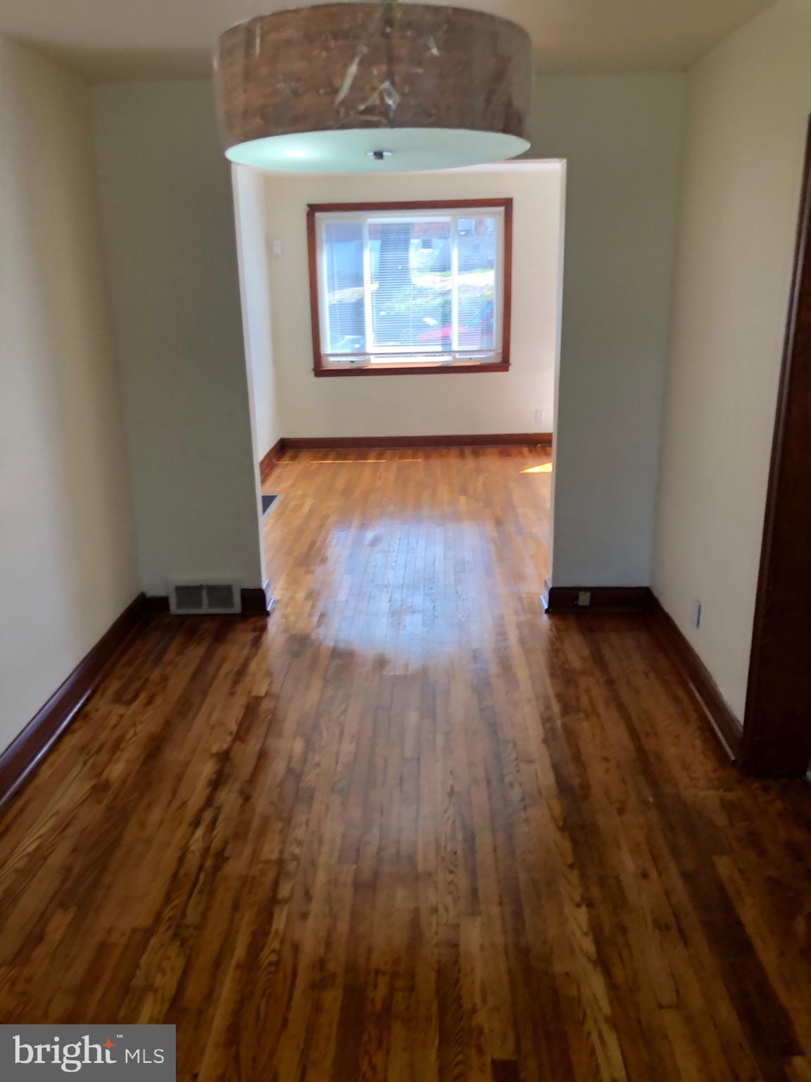 319 Grove Park Road Baltimore, MD 21225 - Photo 31 of 59 living room and dining combo