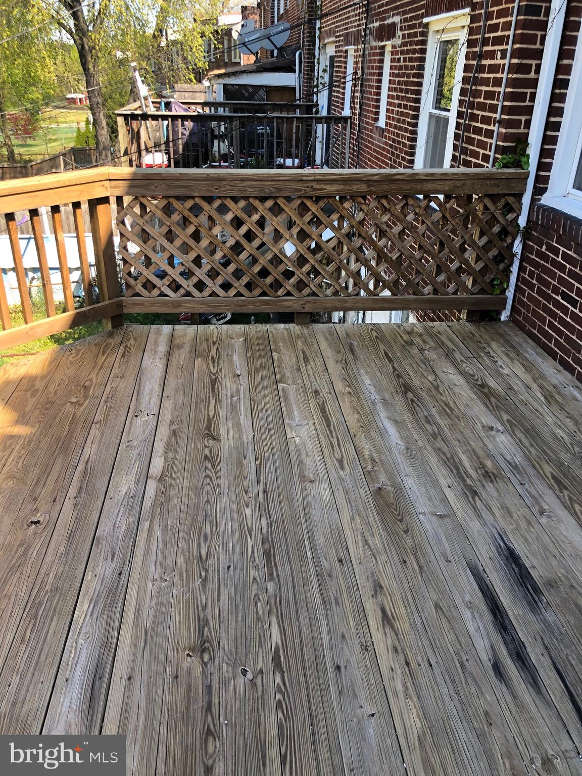 319 Grove Park Road Baltimore, MD 21225 - Photo 40 of 59 Large Deck leading from kitchen