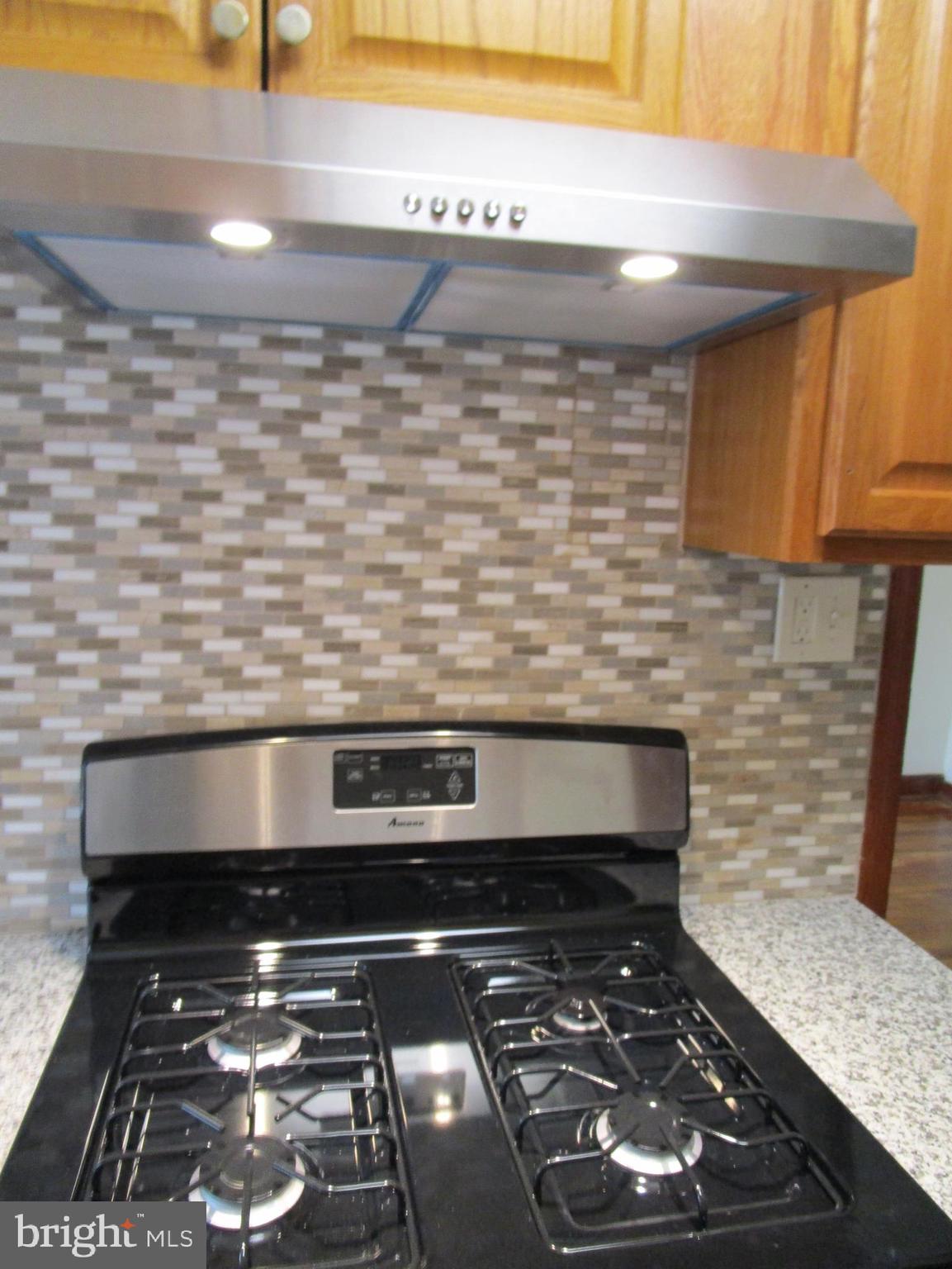 319 Grove Park Road Baltimore, MD 21225 - Photo 44 of 59 New kitchen with gas stove. Never used!