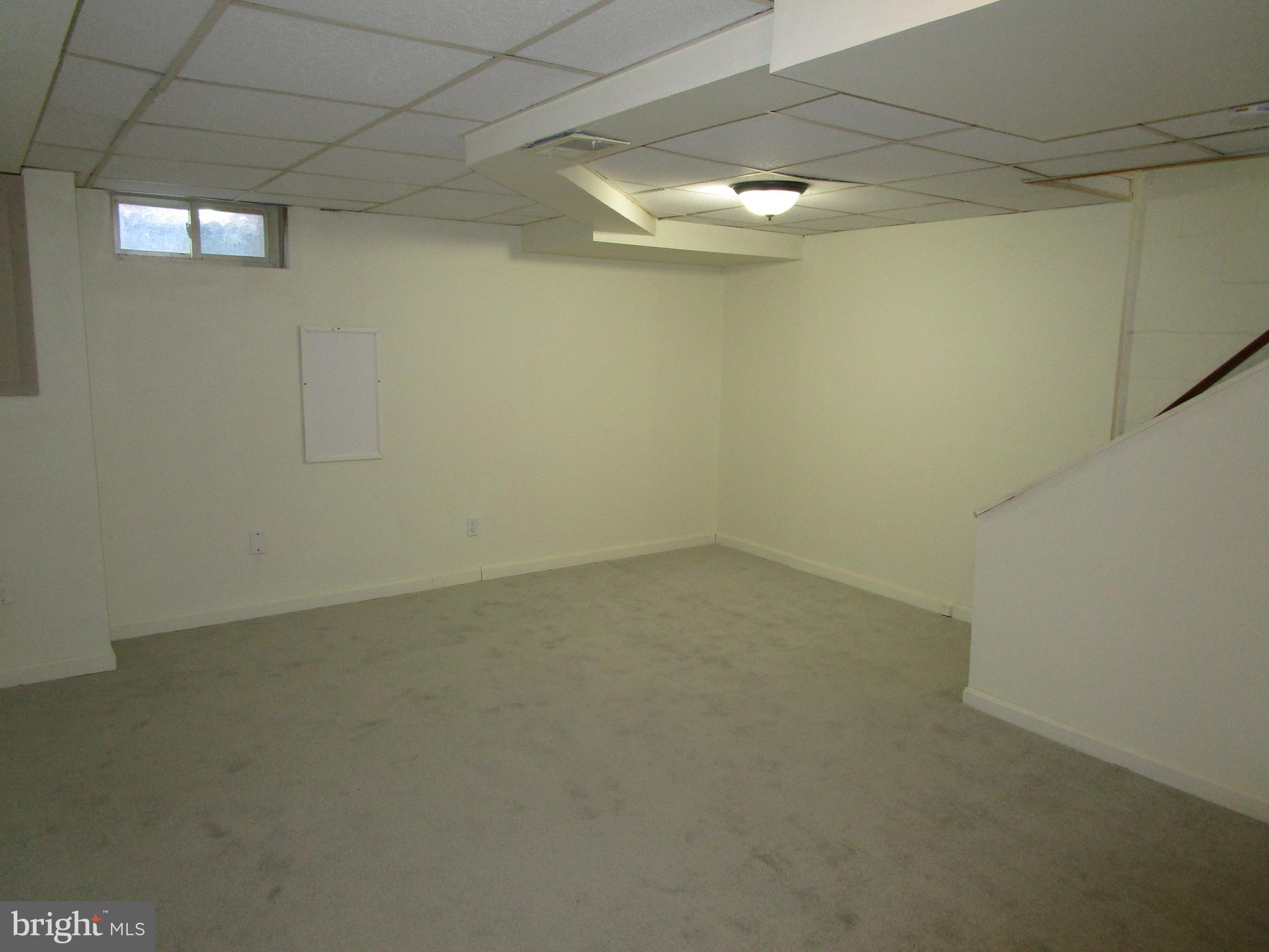 319 Grove Park Road Baltimore, MD 21225 - Photo 56 of 59 Finished basement with carpet