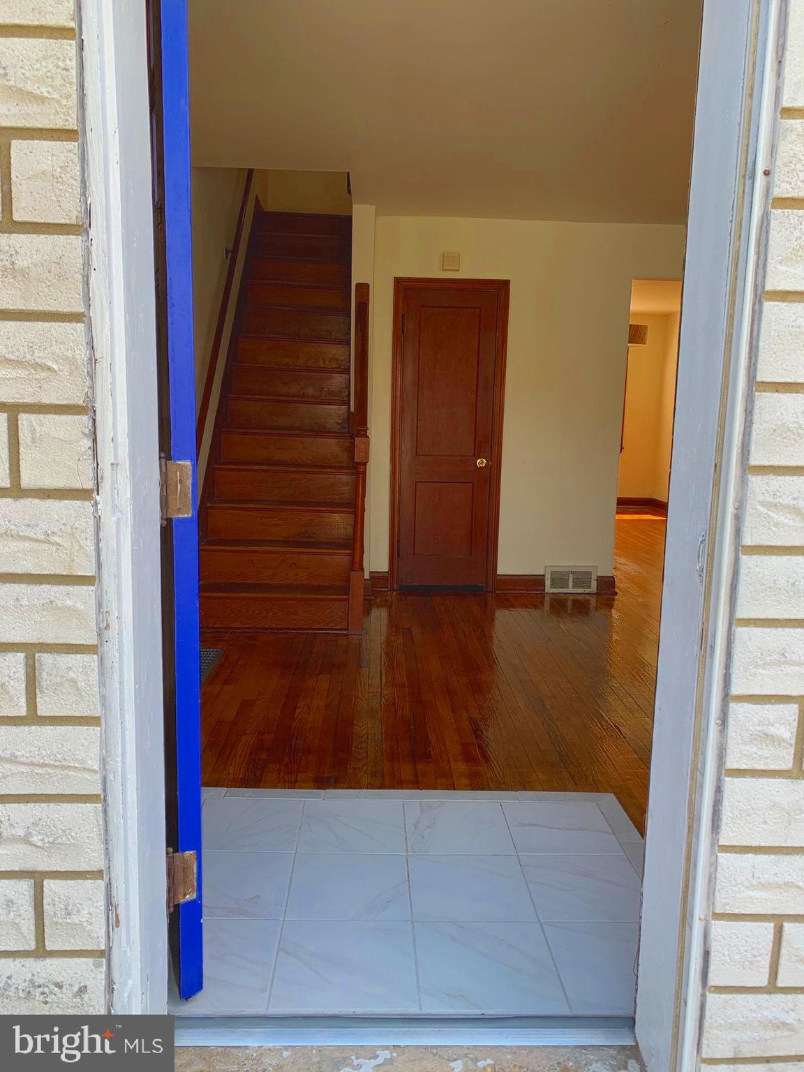 319 Grove Park Road Baltimore, MD 21225 - Photo 9 of 59 Custom ceramic foyer. Original Hardwood floors.