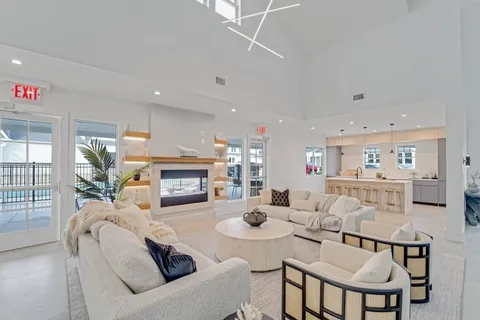 a living room with fireplace furniture and a fireplace