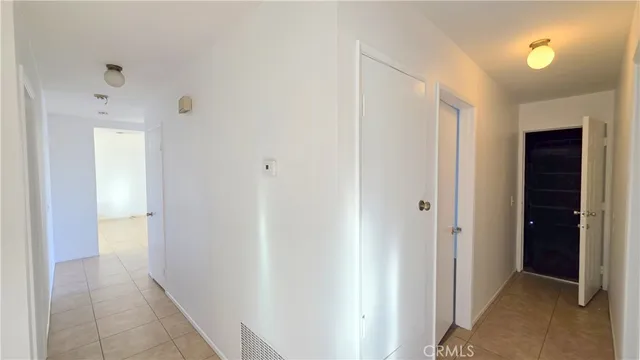 a view of a hallway with a closet