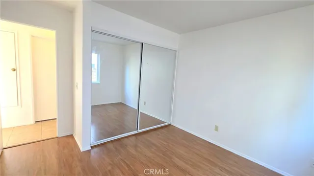 an empty room with wooden floor