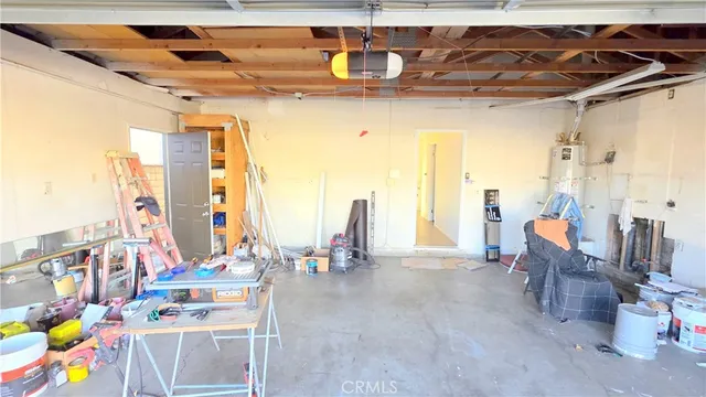 a dining room with furniture and a floor to ceiling window