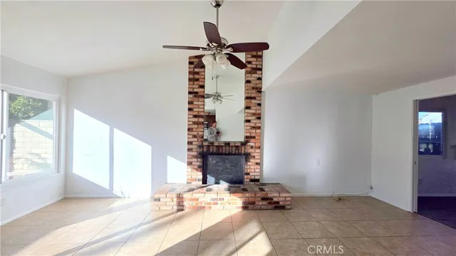 a bedroom with bed and a window