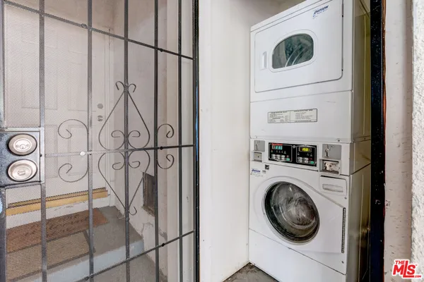 a view of storage and utility room with washer and dryer