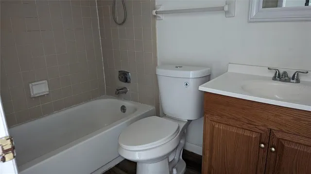 a bathroom with a sink a toilet and bathtub