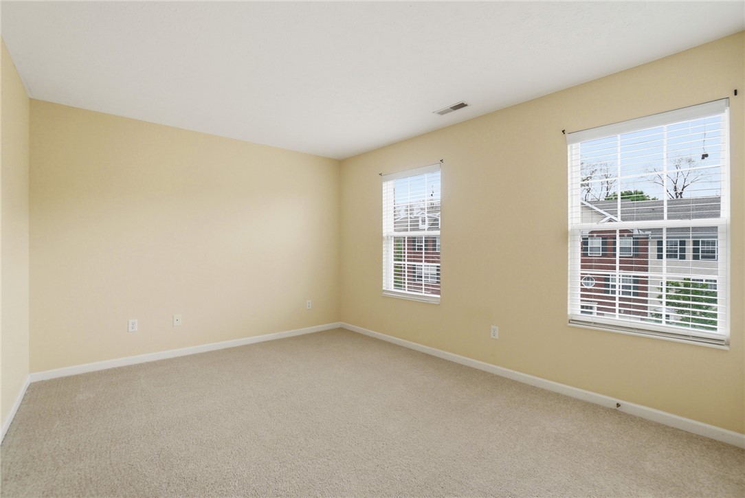 4324 Straight Arrow Road Dayton, OH 45430 - Photo 33 of 40 This spacious bedroom offers ample natural light and a neutral palette, awaiting your personal touch.
