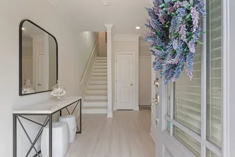 a spacious bathroom with a window double vanity and a window
