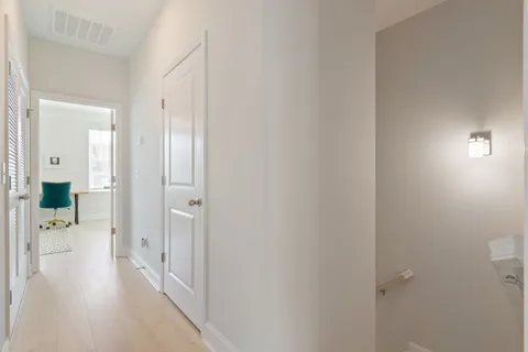 a bathroom with a sink a toilet a mirror a vanity and shower