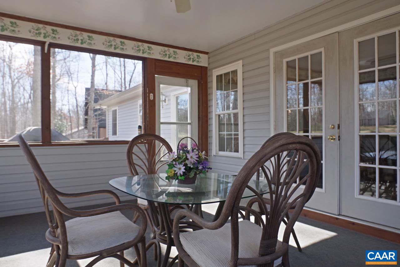 7 Out Of Bounds Road Palmyra, VA 22963 - Photo 33 of 64 a dining room with furniture window and wooden floor