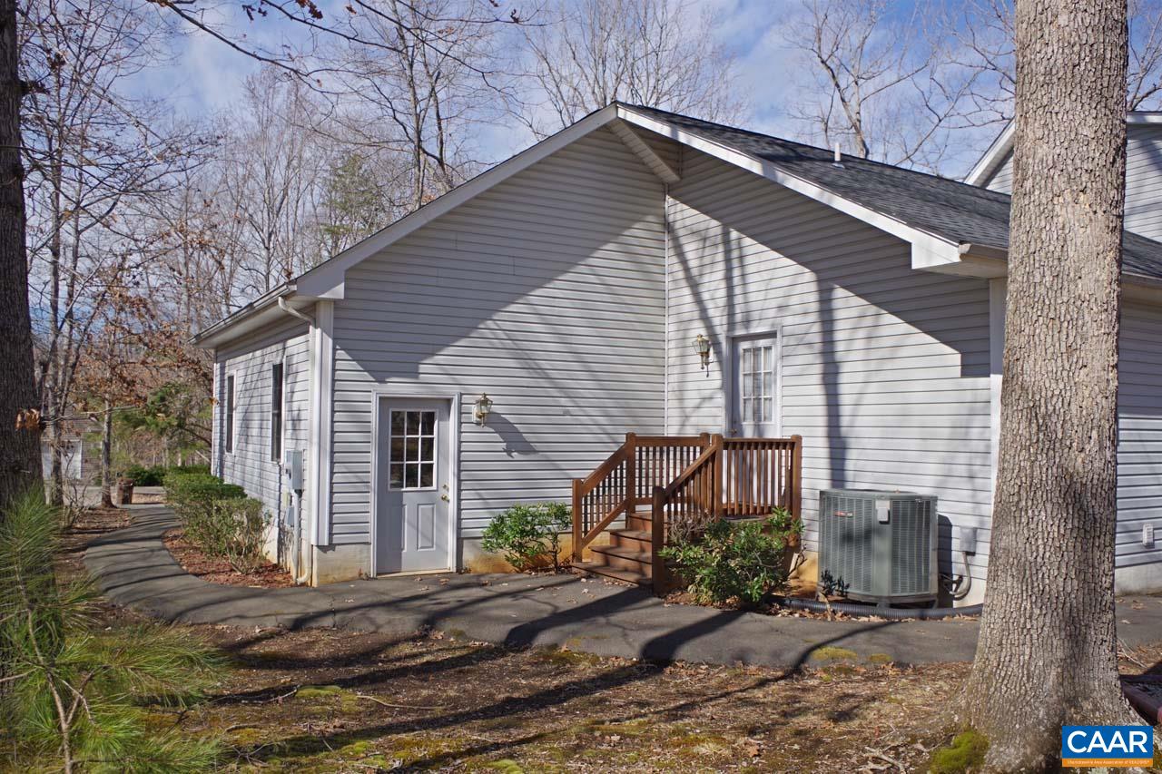 7 Out Of Bounds Road Palmyra, VA 22963 - Photo 54 of 64 a front view of a house with garden
