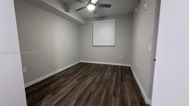 a view of wooden floor in an empty room