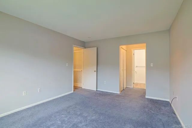 a view of an empty room and a window