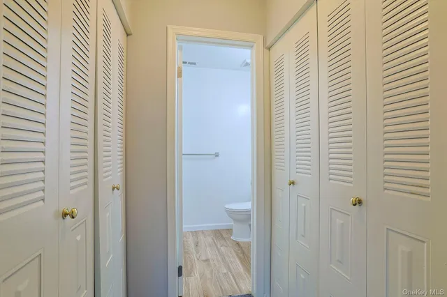 a view of a bathroom from a hallway