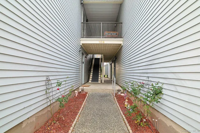 a view of a house with a door and wooden floor