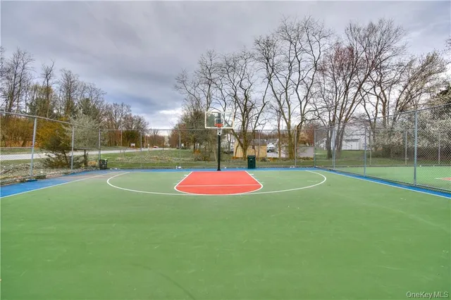 a view of a playground with basketball court