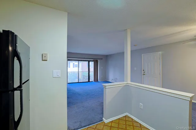 a view of a hallway with entryway