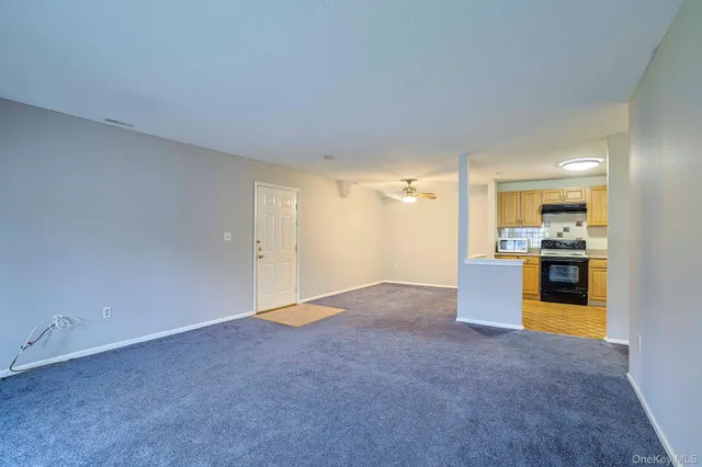 a view of kitchen and kitchen with granite countertop