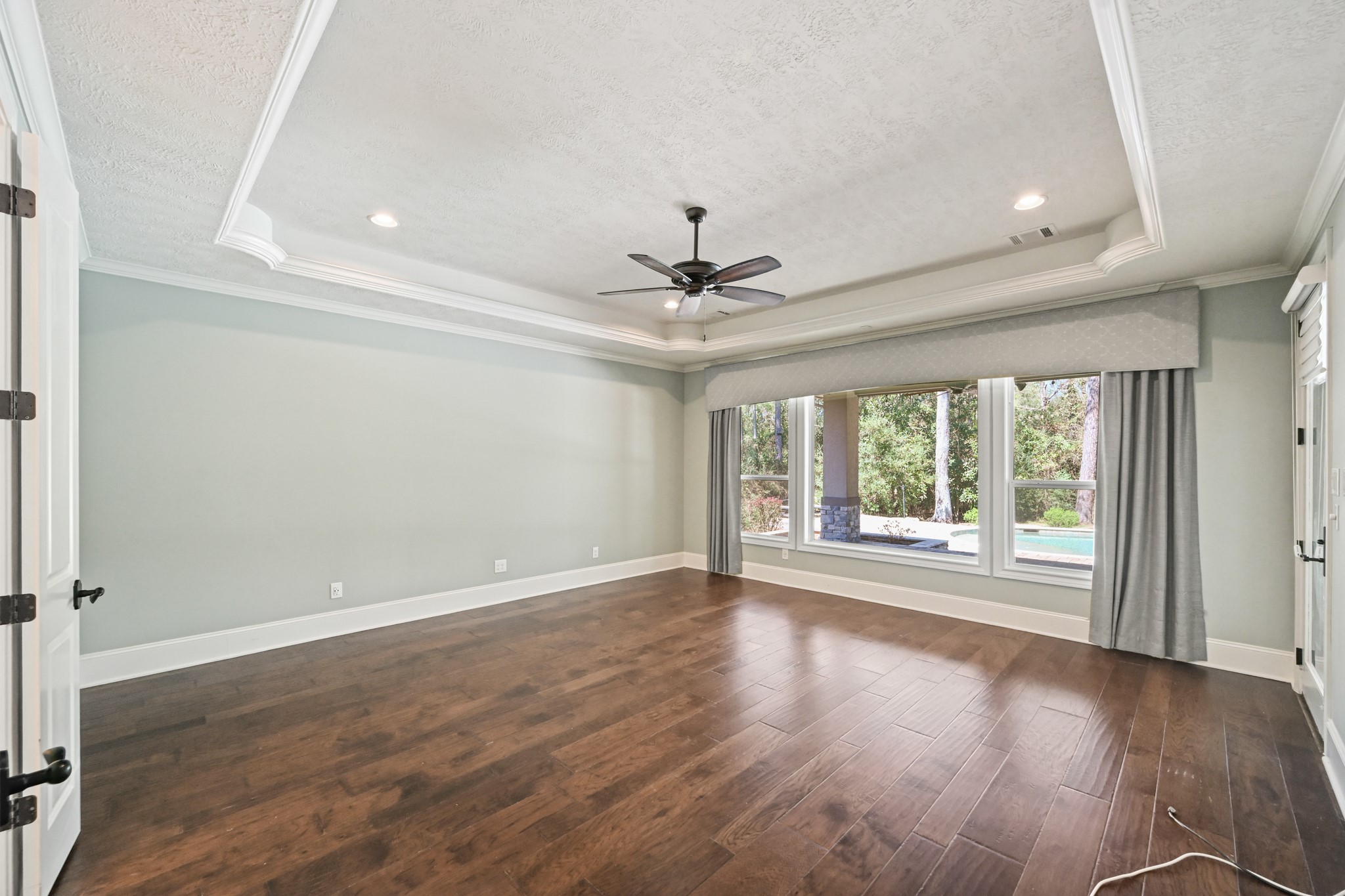 27322 Silver Jade Court Spring, TX 77386 - Photo 15 of 45 Primary bedroom with access to outside covered patio and pool.