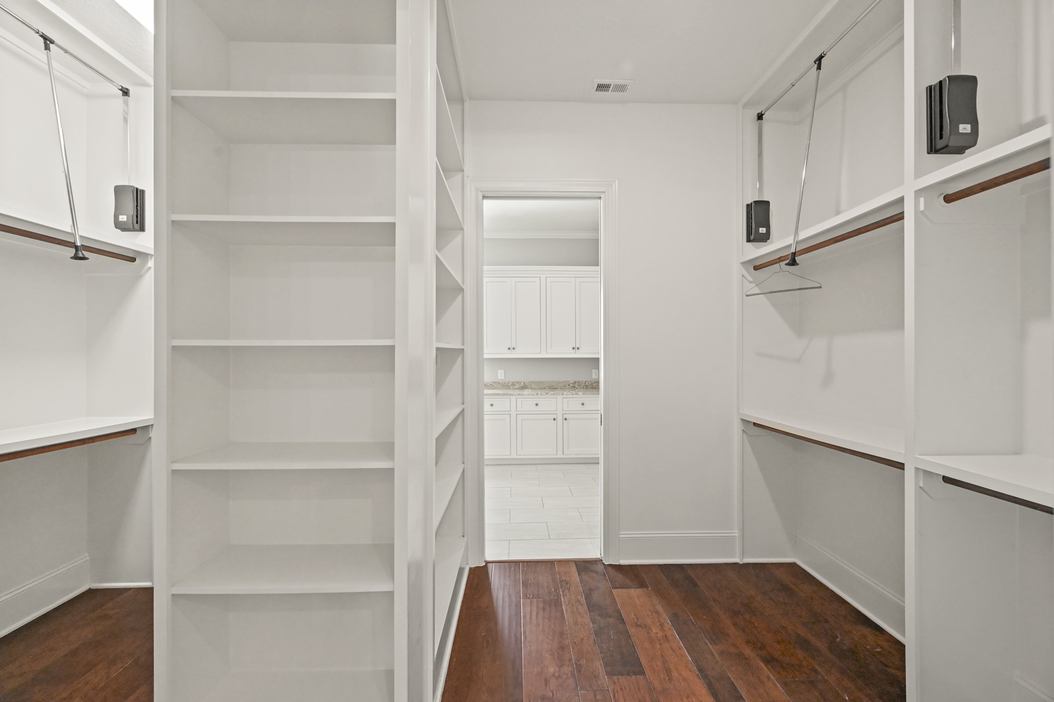 27322 Silver Jade Court Spring, TX 77386 - Photo 21 of 45 Large primary closet, be sure to check out the under stair storage.