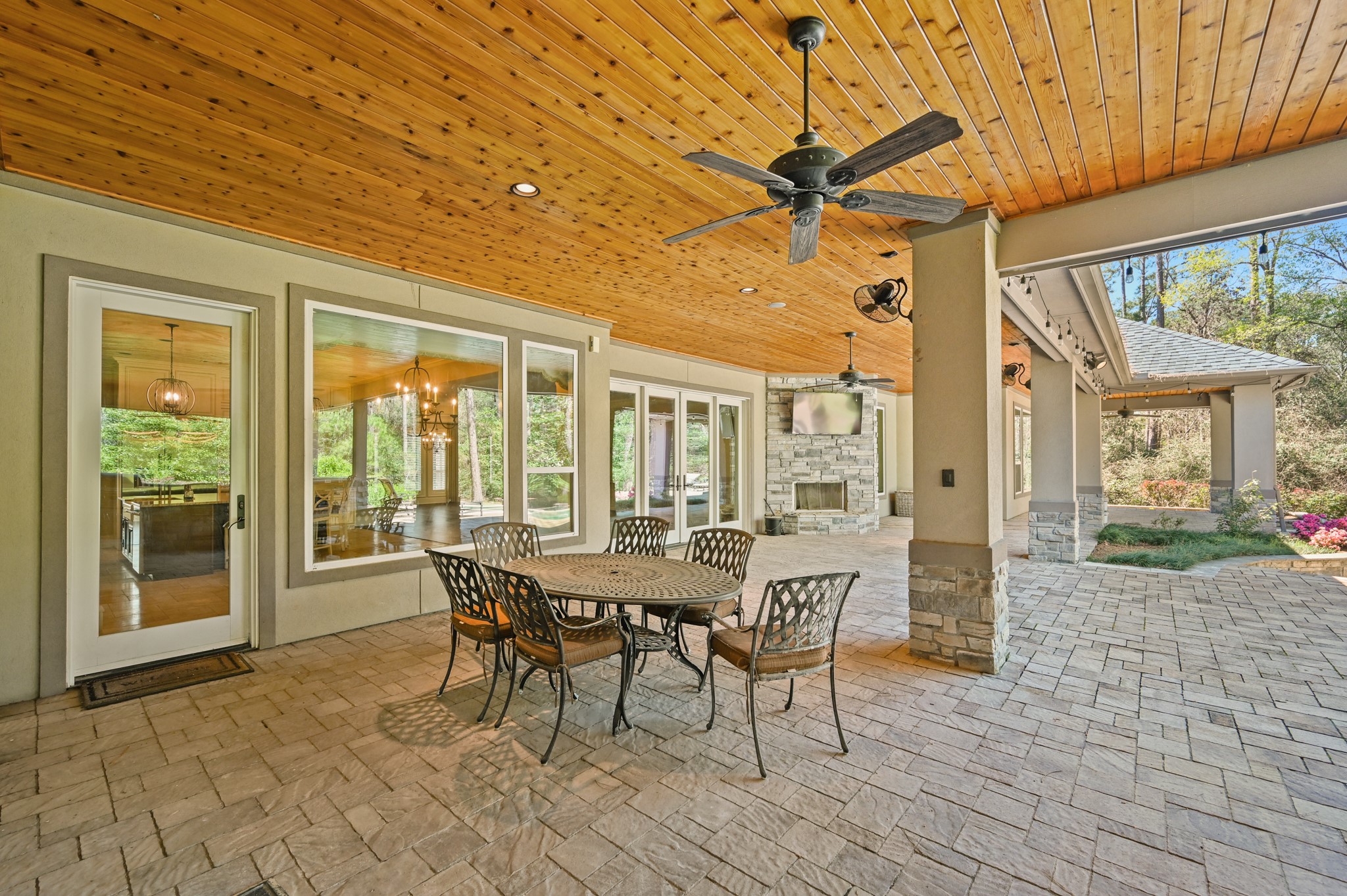 27322 Silver Jade Court Spring, TX 77386 - Photo 40 of 45 Covered paver patio has stone wood burning fireplace plus outdoor eating area.