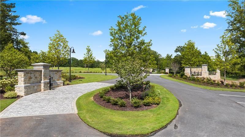 2050 Magnolia Lane Milton, GA 30004 - Photo 18 of 21 a swimming pool with outdoor seating and yard