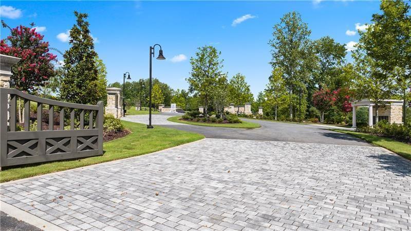 2050 Magnolia Lane Milton, GA 30004 - Photo 20 of 21 a view of a house with backyard and garden