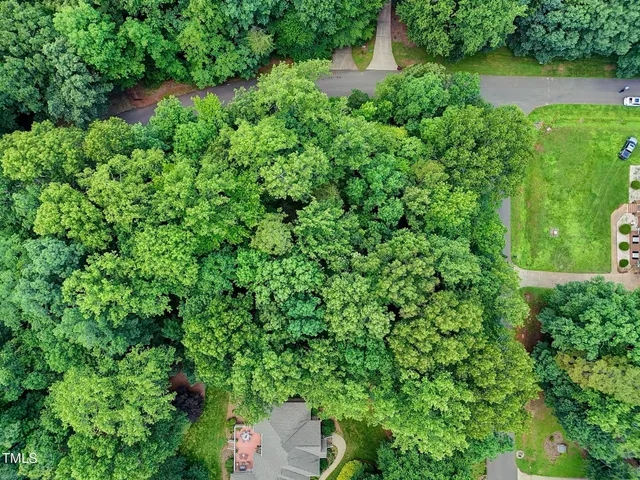 an aerial view of a house with pool outdoor seating and yard