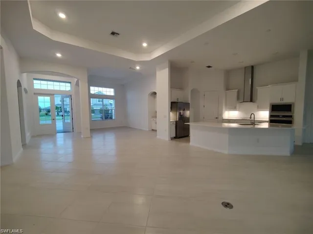 a view of a kitchen with furniture and cabinets