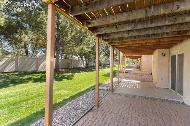 a view of a porch with wooden floor and fence