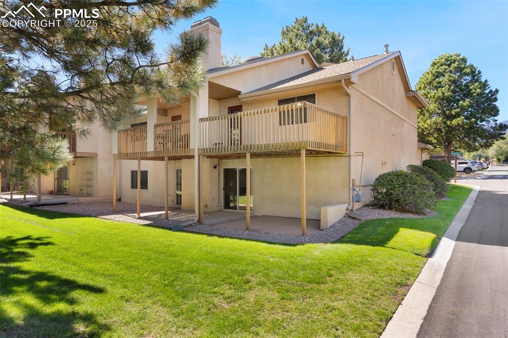 2005 Windham Way, Unit 8 Colorado Springs, CO 80906 - Photo 20 of 35 a view of a house with a yard and sitting area