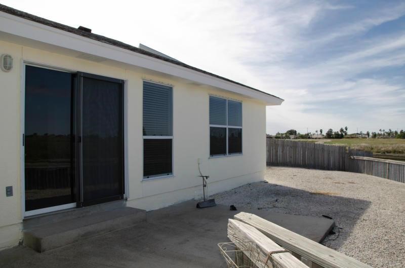 14302 Cruiser Street, Unit A Corpus Christi, TX 78418 - Photo 19 of 28 a swimming pool with outdoor seating and yard