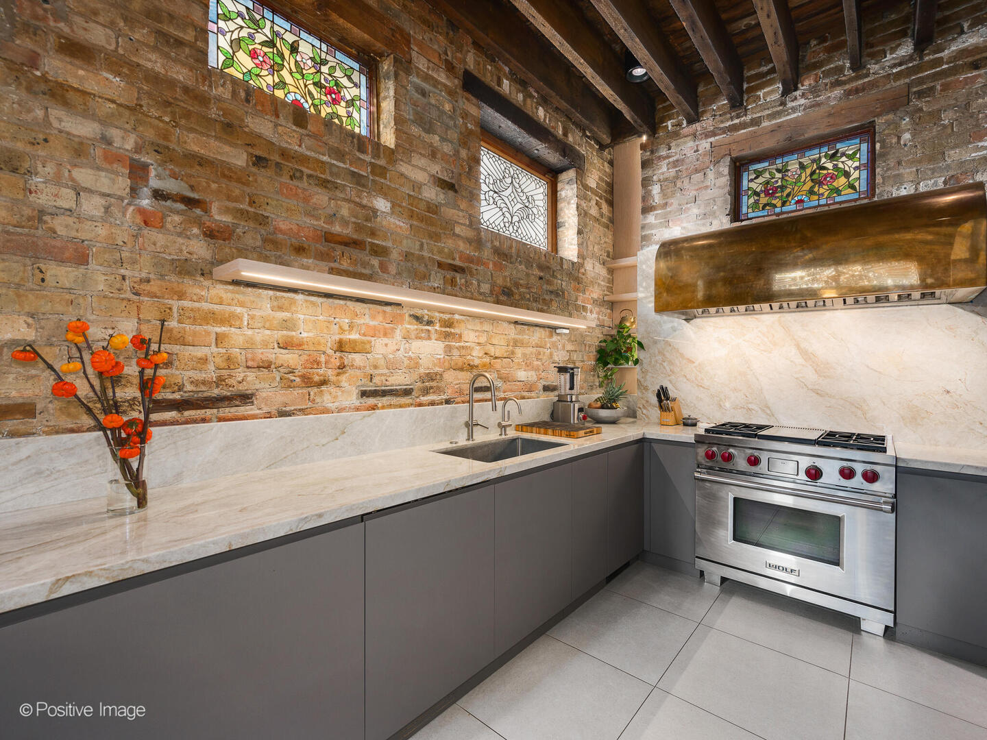 844 West Altgeld Street Chicago, IL 60614 - Photo 11 of 27 a kitchen with stainless steel appliances granite countertop a sink and a stove