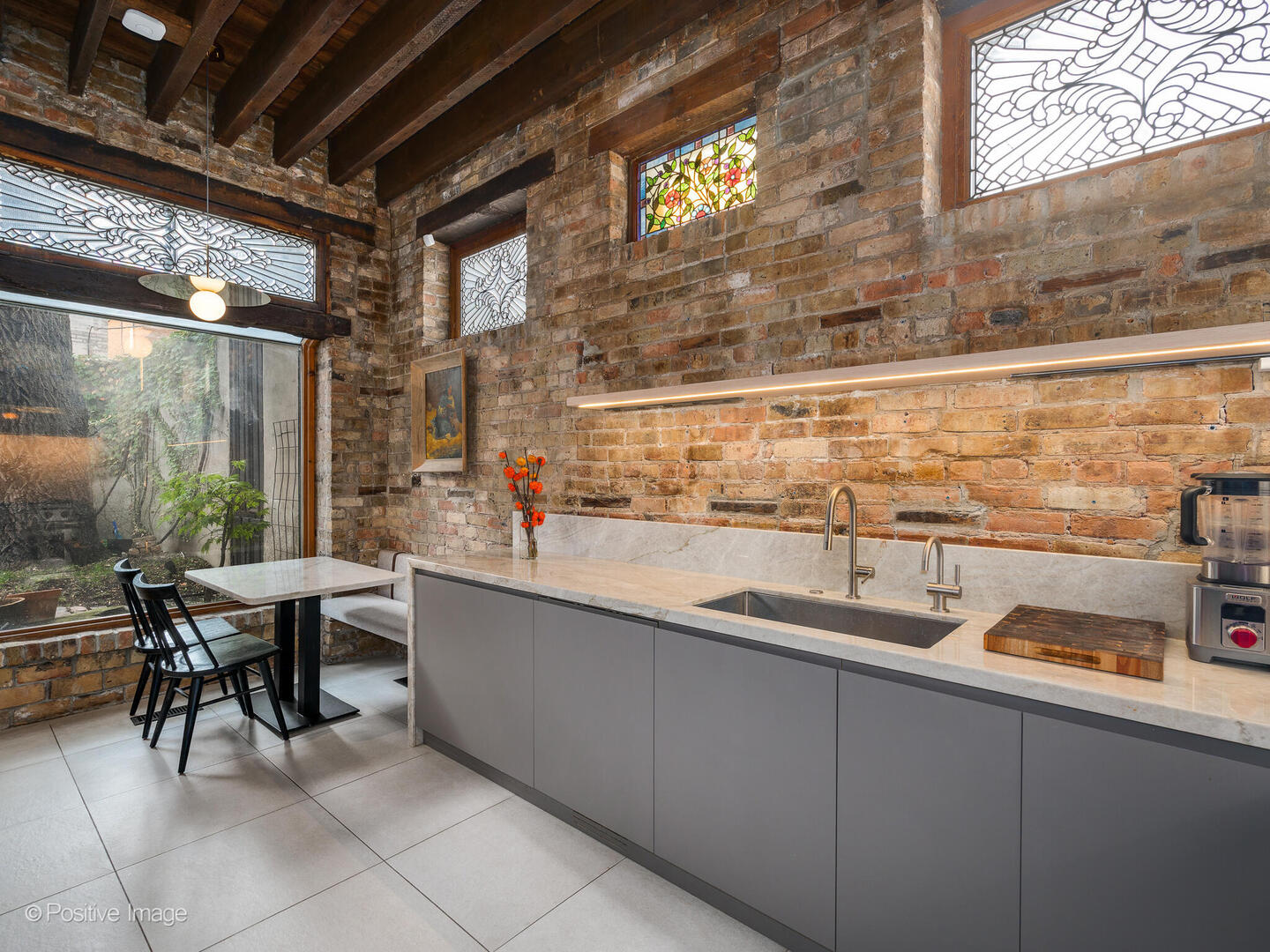 844 West Altgeld Street Chicago, IL 60614 - Photo 14 of 27 a kitchen with a sink and large windows