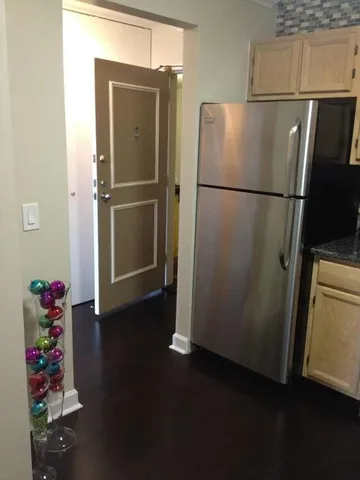 a refrigerator freezer sitting inside of a kitchen