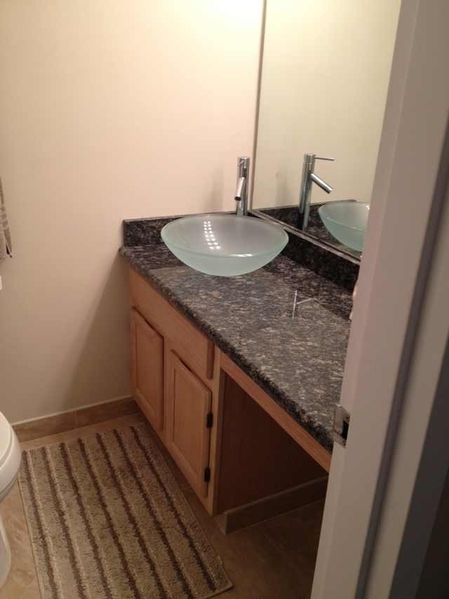 200 North Dearborn Street, Unit 2703 Chicago, IL 60601 - Photo 15 of 16 a bathroom with a granite countertop sink and a mirror