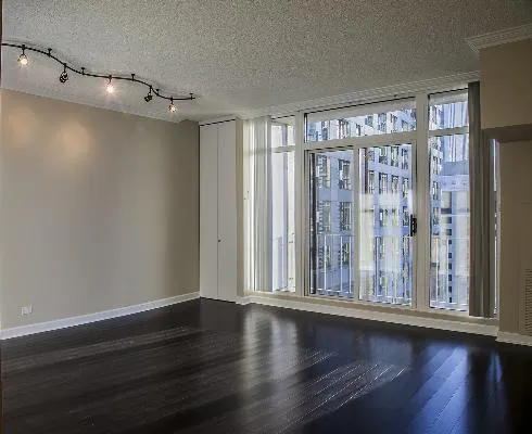 a view of room with hardwood floor and window