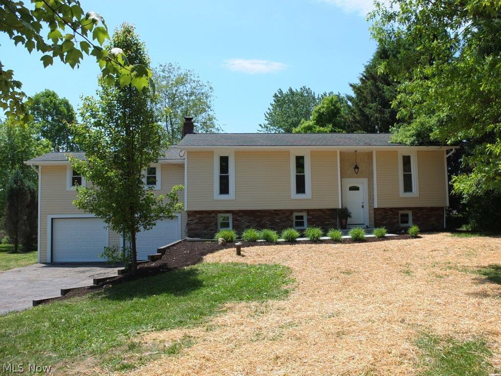 Completely remodeled 4 bedroom, 3 full bath home on 2.8 acres with pond!