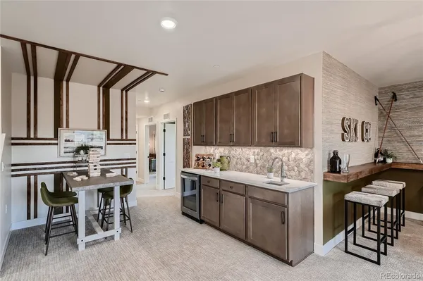 a kitchen with a sink cabinets and a stove
