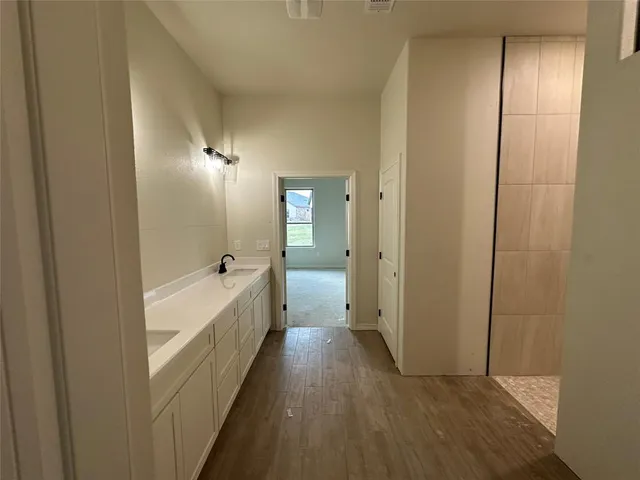 a bathroom with a bathtub and a shower